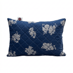 Blue pillow with floral patterns on a white background