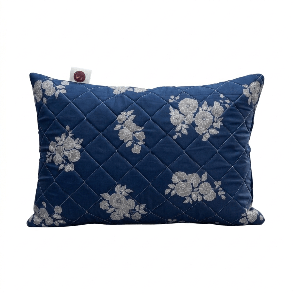 Blue pillow with floral patterns on a white background